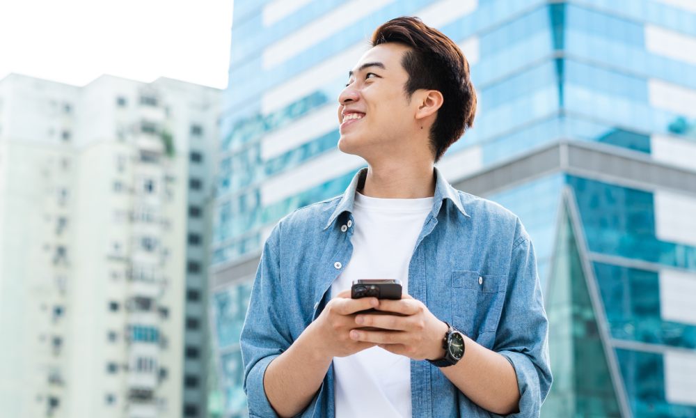 Asian man walking on the street
